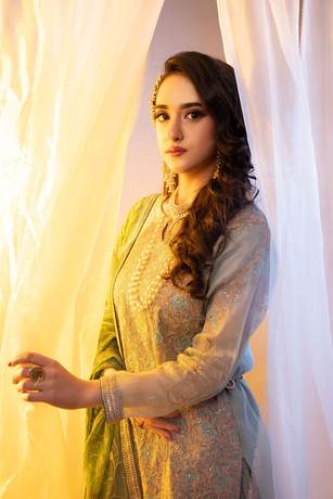 Mehndi look behind sheer curtains