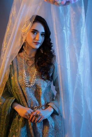 Mehndi look behind sheer curtains