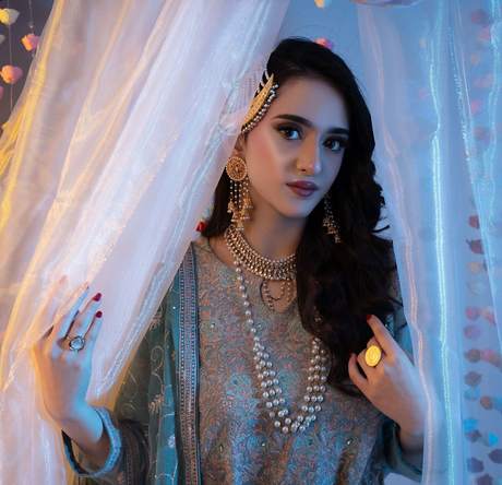 Mehndi look behind sheer curtains