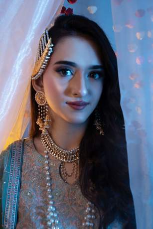 Mehndi look behind sheer curtains