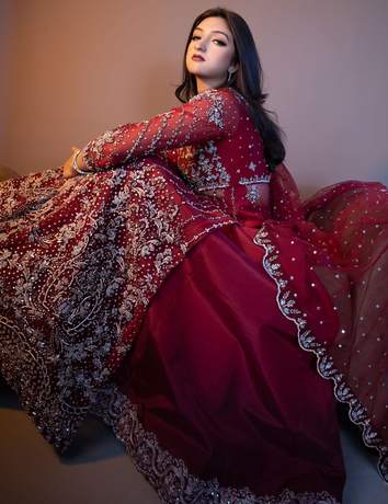 Bride in a deep red embellished gown