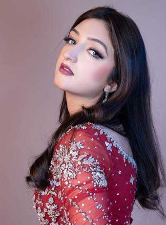 Bride in a deep red embellished gown