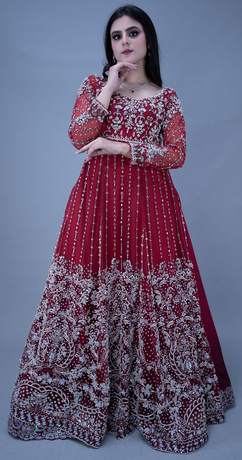Bride in a scarlet gown with silver work