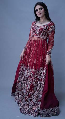 Bride in a scarlet gown with silver work