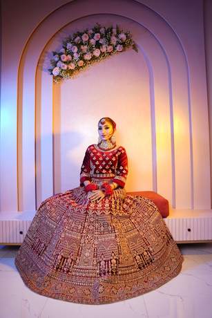 Bride in maroon velvet with gold work
