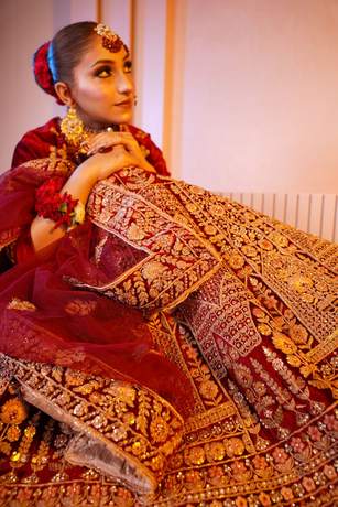 Bride in maroon velvet with gold work
