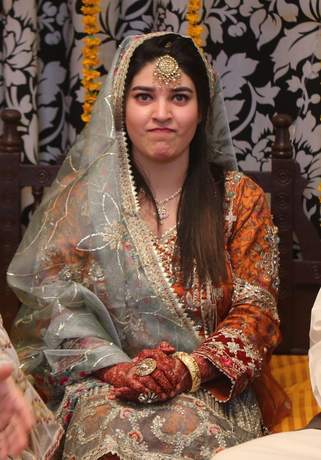 Seated bride in bridal wear